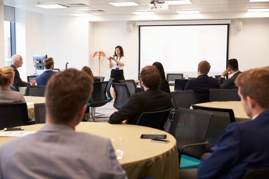 Businesswoman Making Presentation At Conference